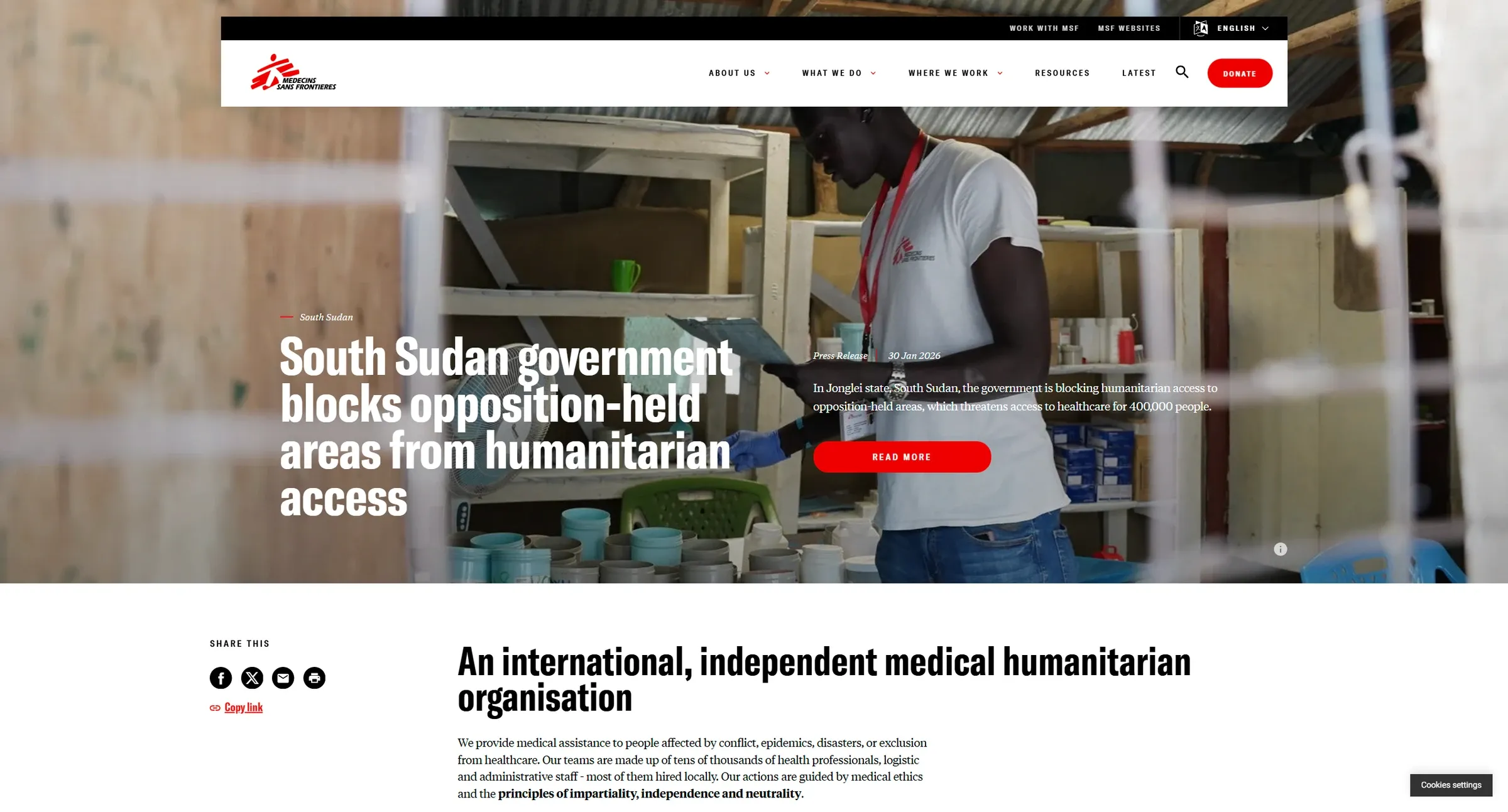 MSF's homepage led by a dated press release over a field photograph, with Donate set apart in red